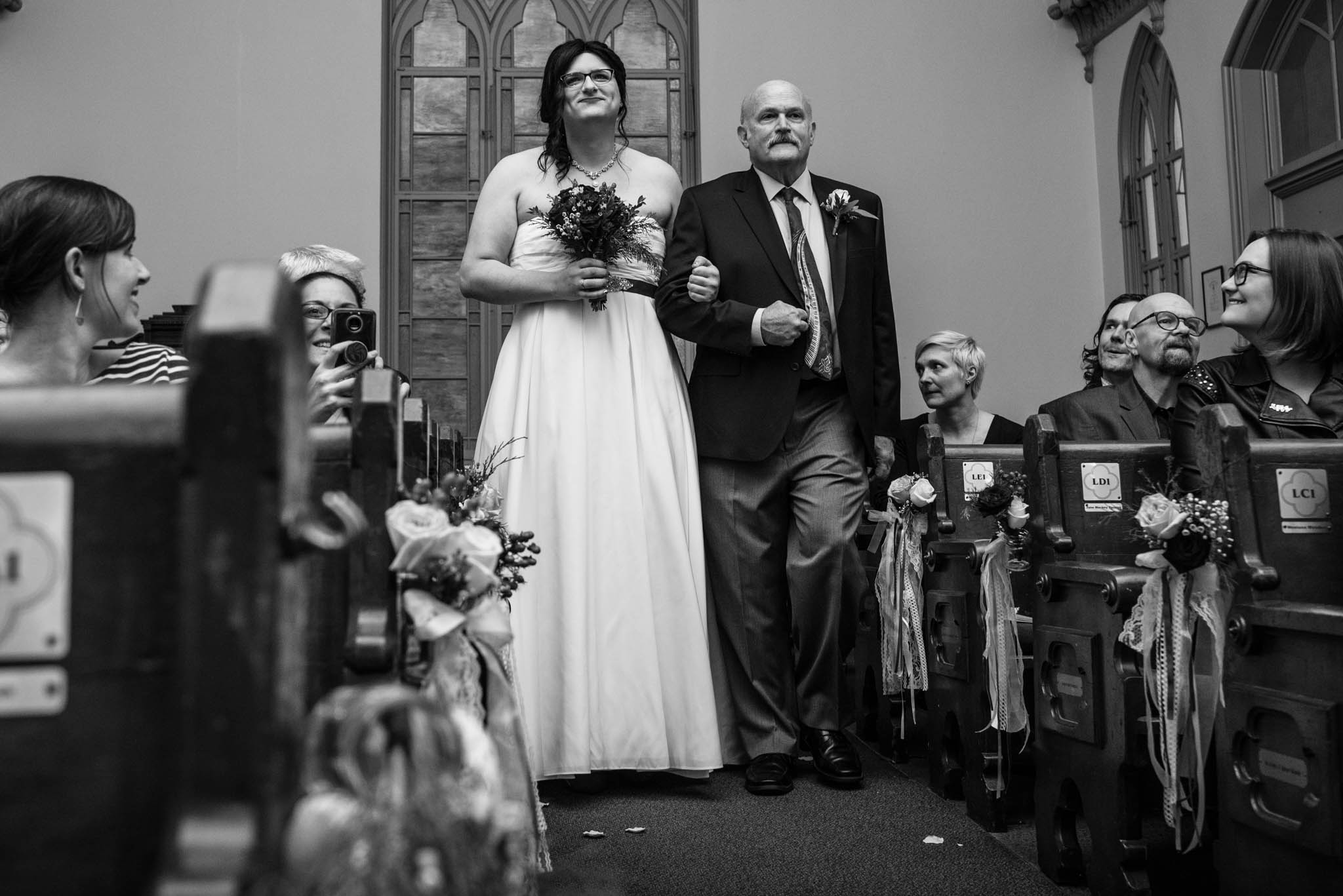 Father walking bride down the aisle