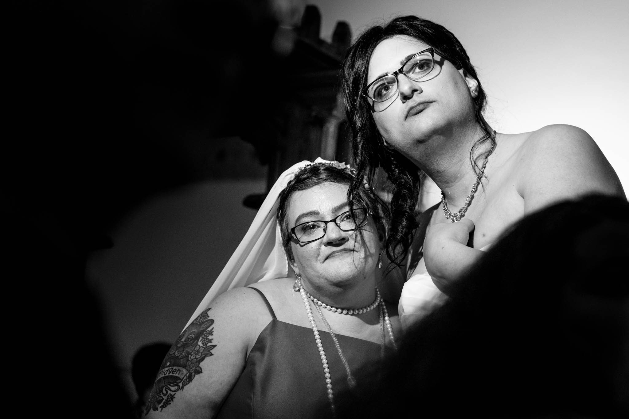 Photograph of two brides during wedding reception