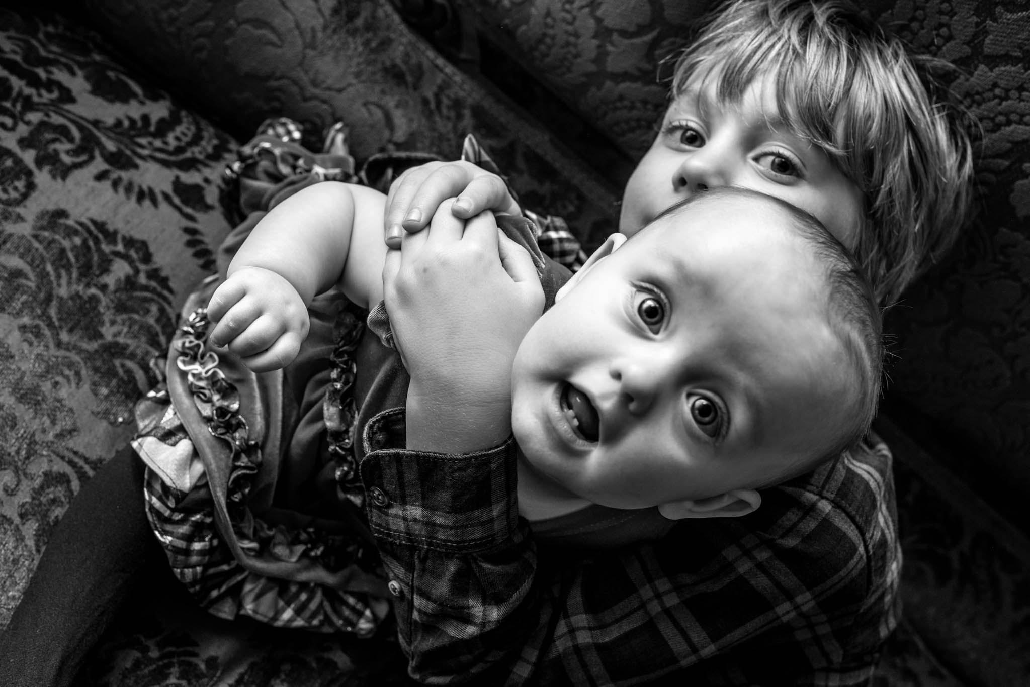 Kids playing on couch during wedding