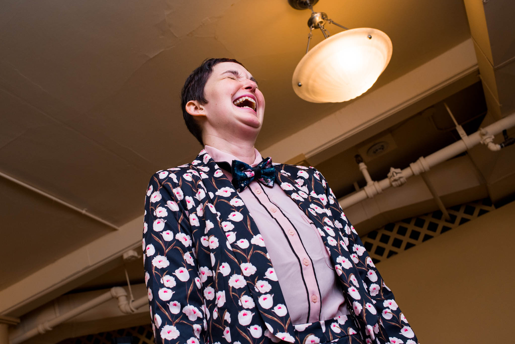 Woman laughing wearing flower suit