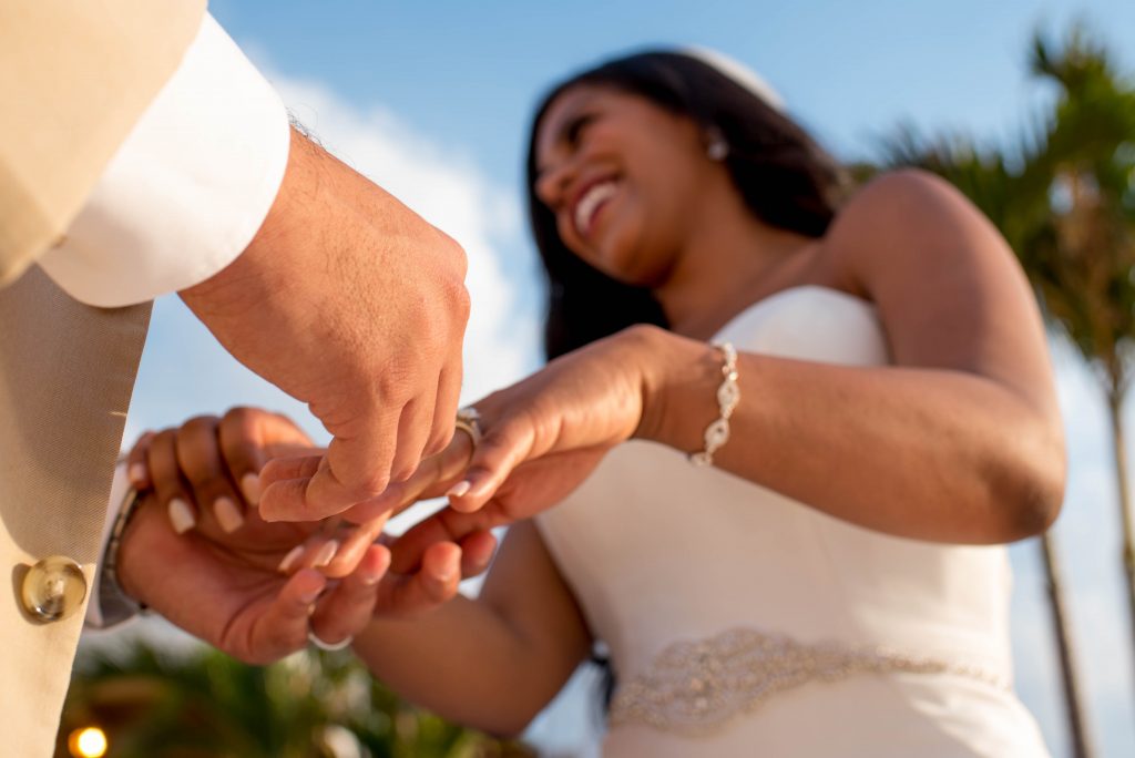 Bride and groom holding hands during wedding ceremony