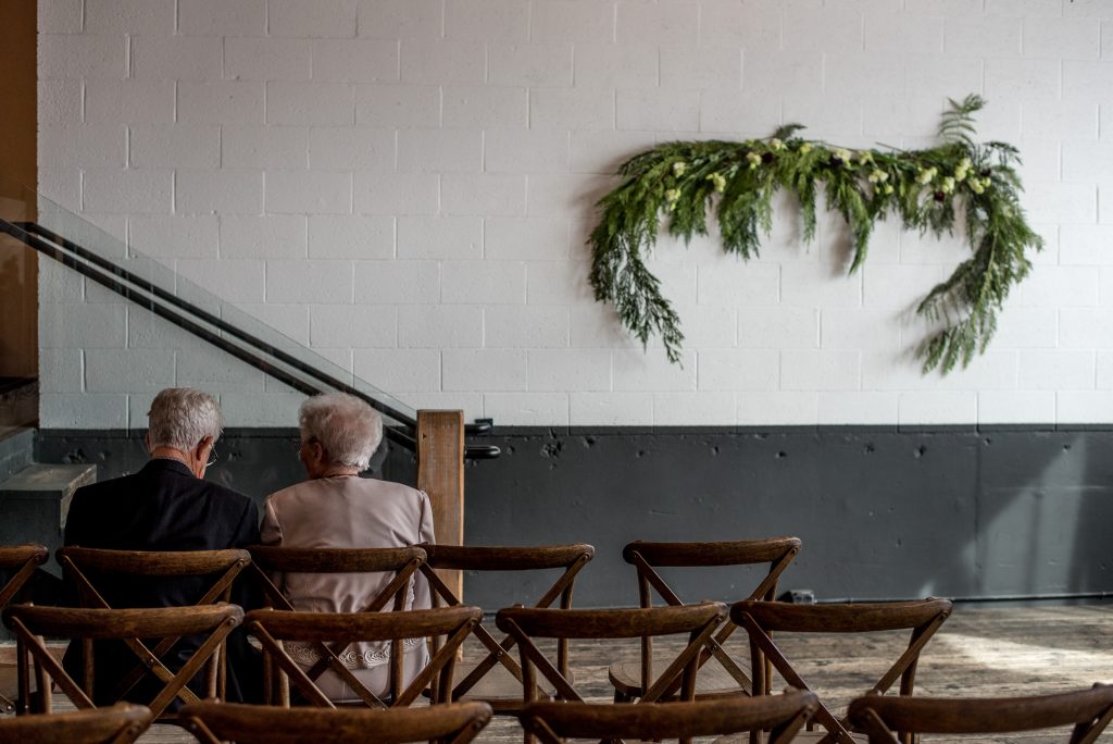 Grandparents sitting alone before the wedding ceremony.