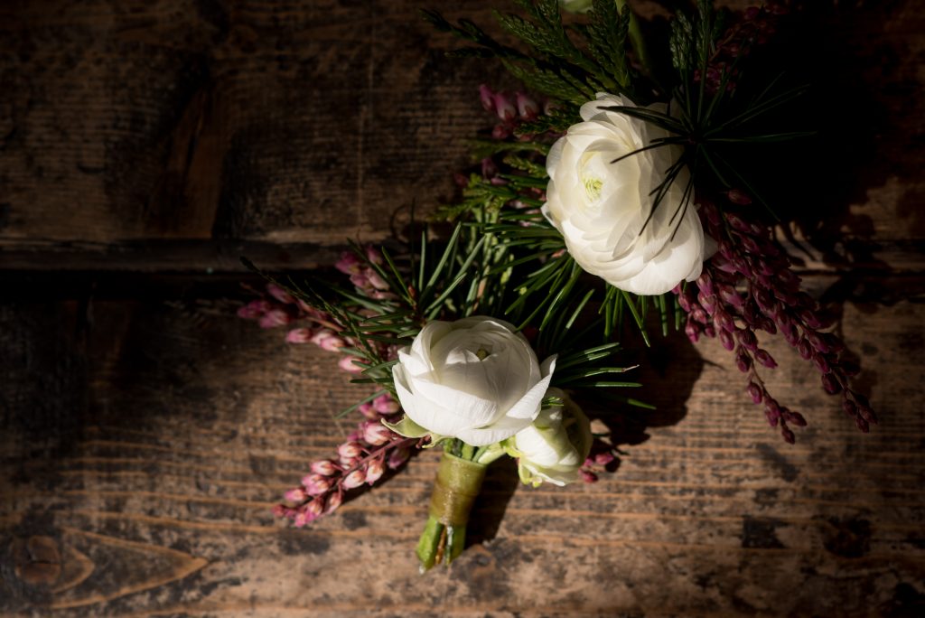 Wedding flowers on the wooden floor inside of Union Pine