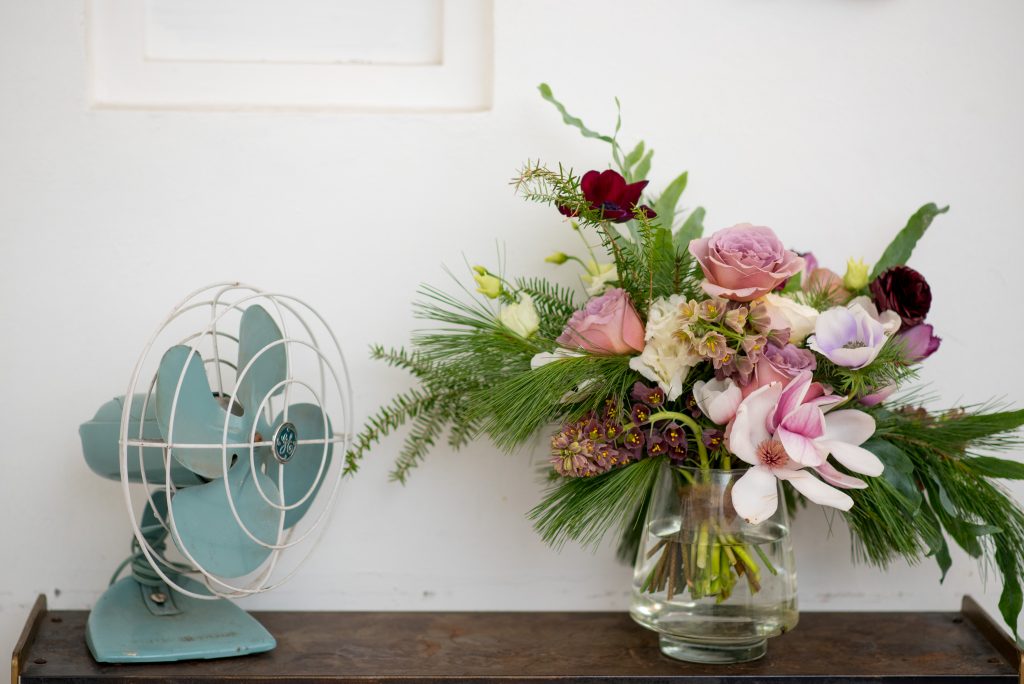 Wedding bouquet with pink flowers and pine foliage