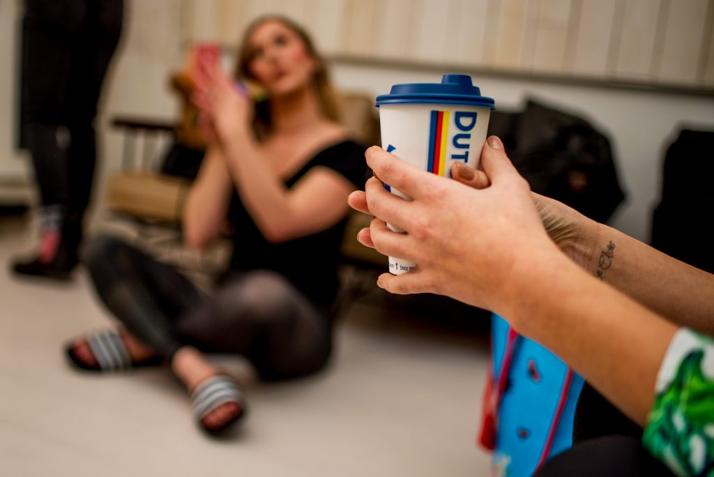 Bride holding a cup of Dutch Brothers coffee