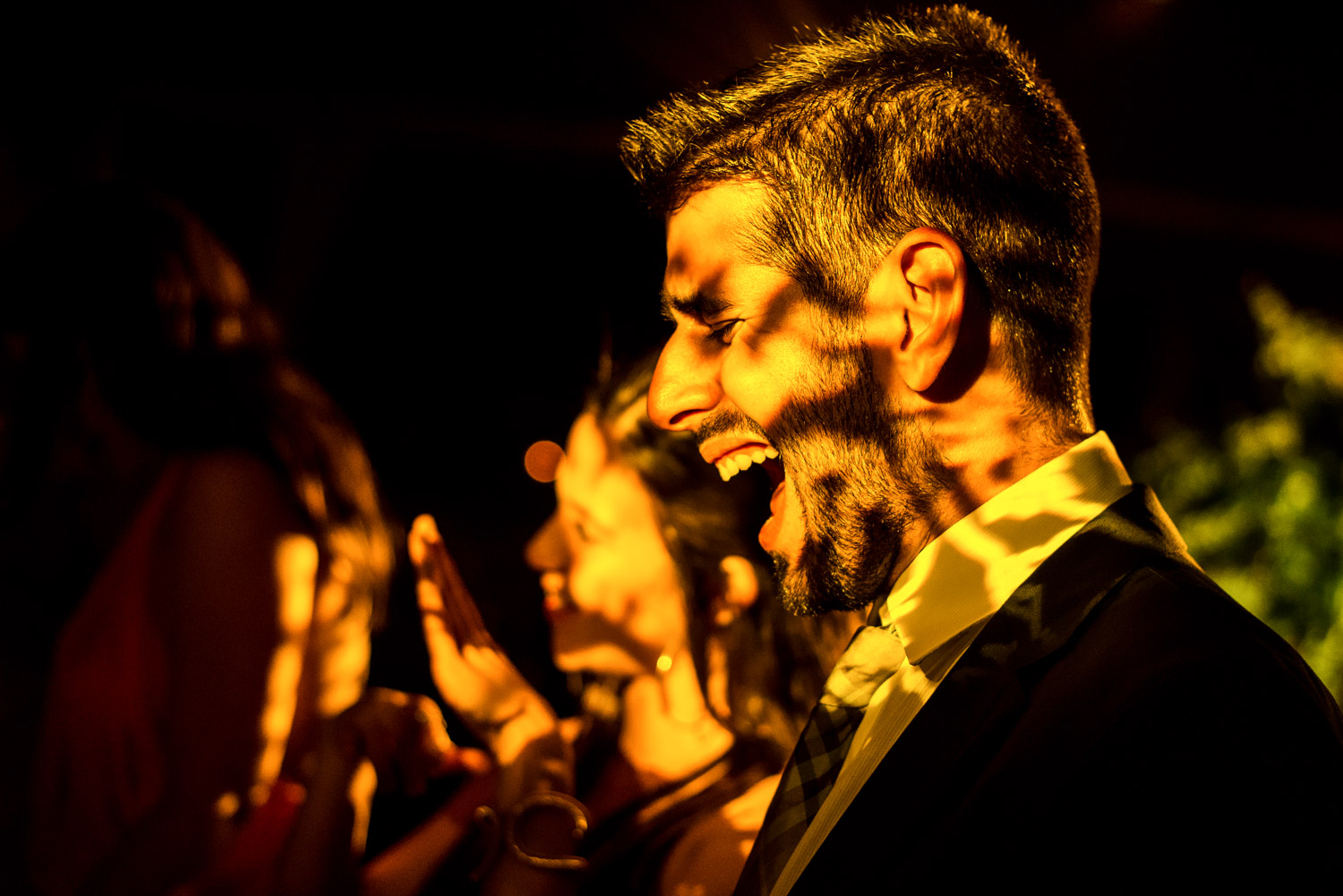 Man lit with lights from a DJ