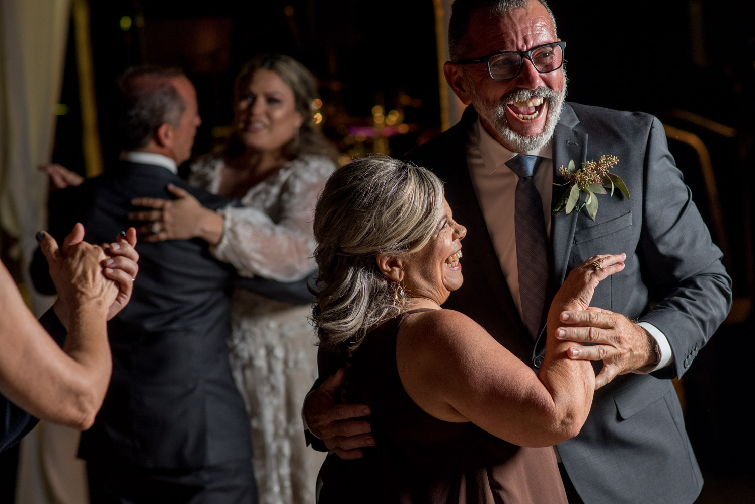 First dances at a dark wedding reception lit with godox