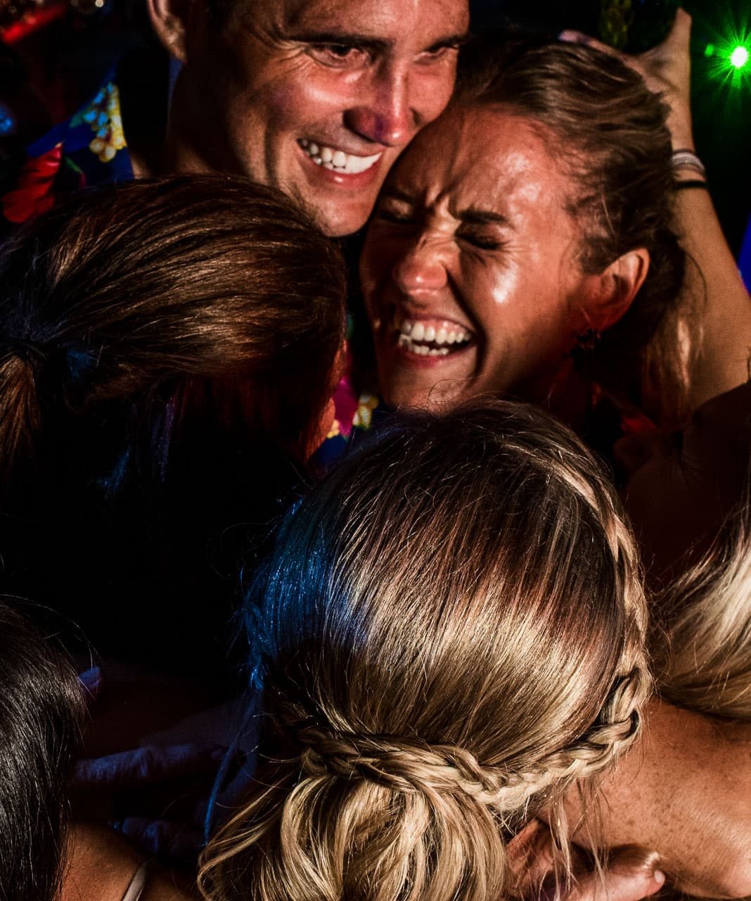 Candid Wedding Photography Austin, Bride and Groom Smiling, Wedding Photography of a candid moment, Group of people all hugging and smiling