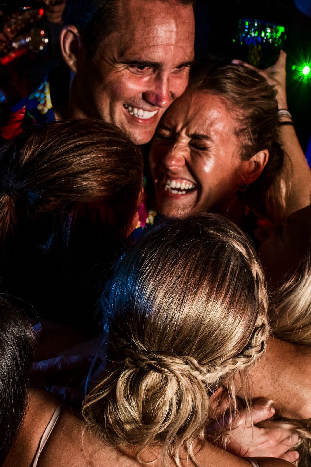 Candid Wedding Photography Austin, Bride and Groom Smiling, Wedding Photography of a candid moment, Group of people all hugging and smiling