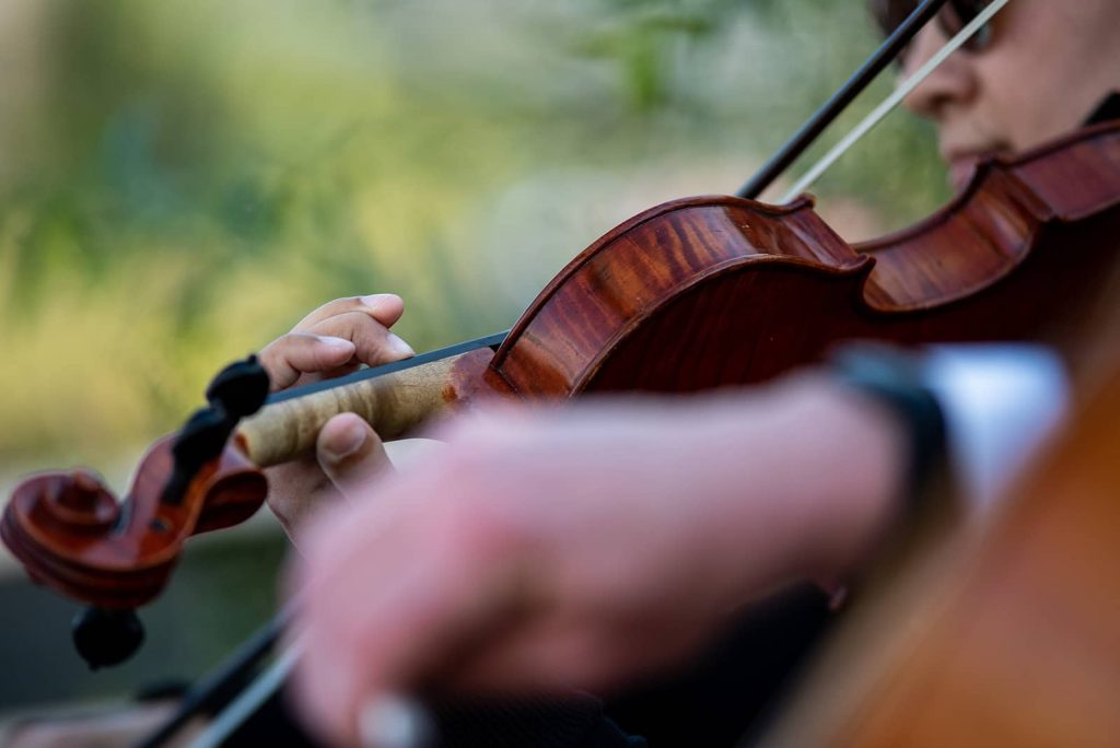 Picture of a violin being played at the ceremony in The Maritime Memorial Park.