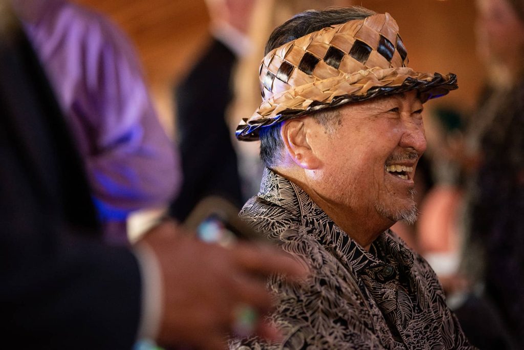 Picture of an elderly wedding guest smiling at the reception at The Loft at The Red Building in Astoria, Oregon.