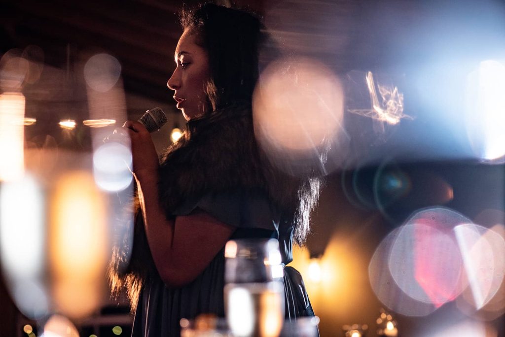 Wedding guest giving a toast at reception at The Loft at The Red Building in Astoria, Oregon