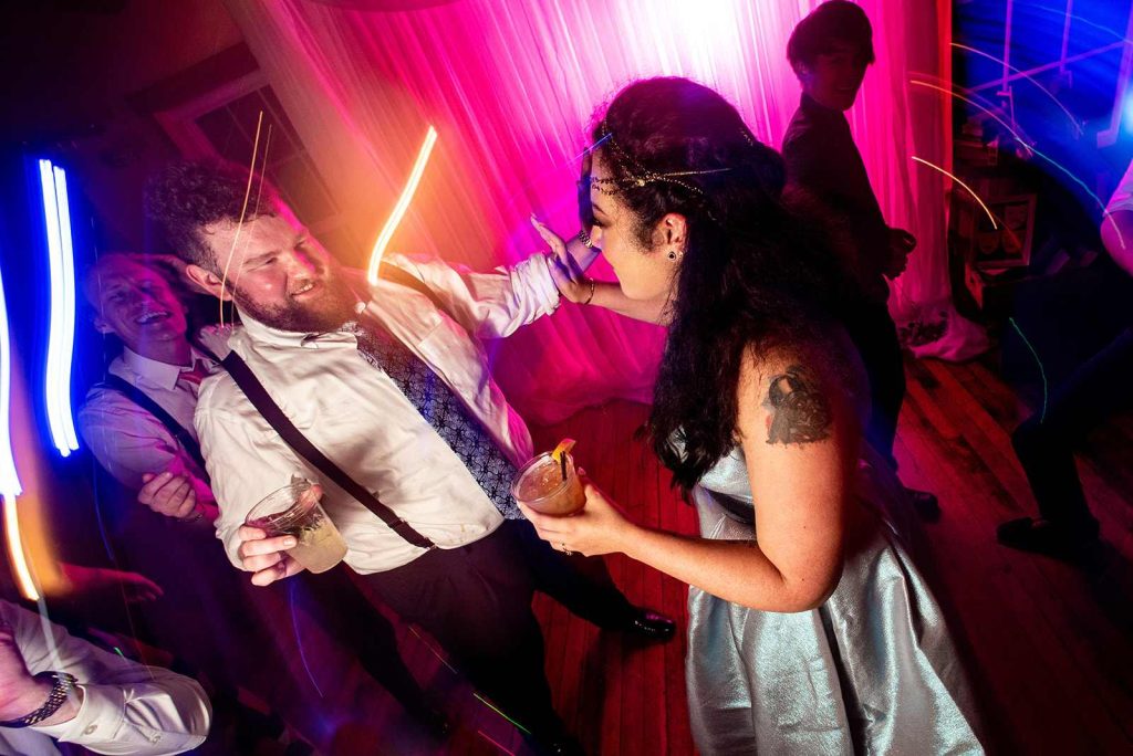 Stylized photo of bride and groom dancing at their reception at The Loft at The Loft at The Red Building in Astoria, Oregon.