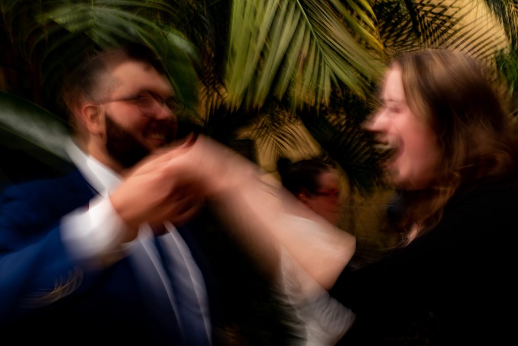 a blurry photo of a man and a woman dancing.