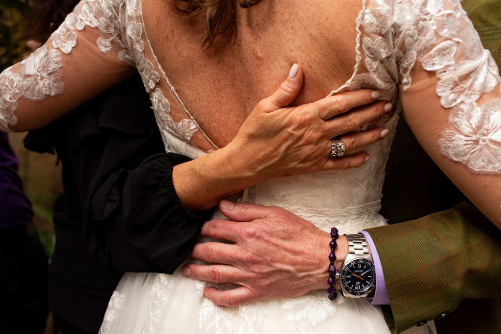 a man and a woman hugging each other.