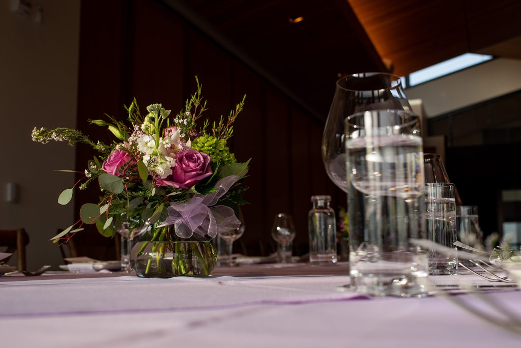 a vase filled with flowers on top of a table.