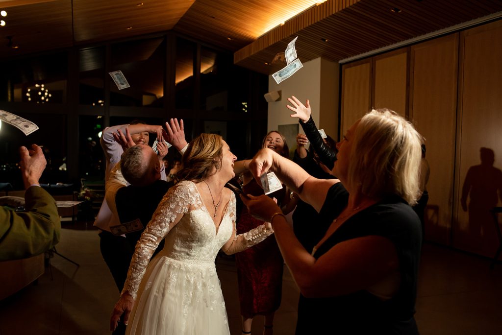 a bride and groom are dancing at their wedding reception.