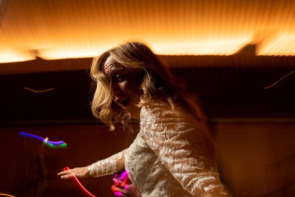 a woman in a white dress is dancing.